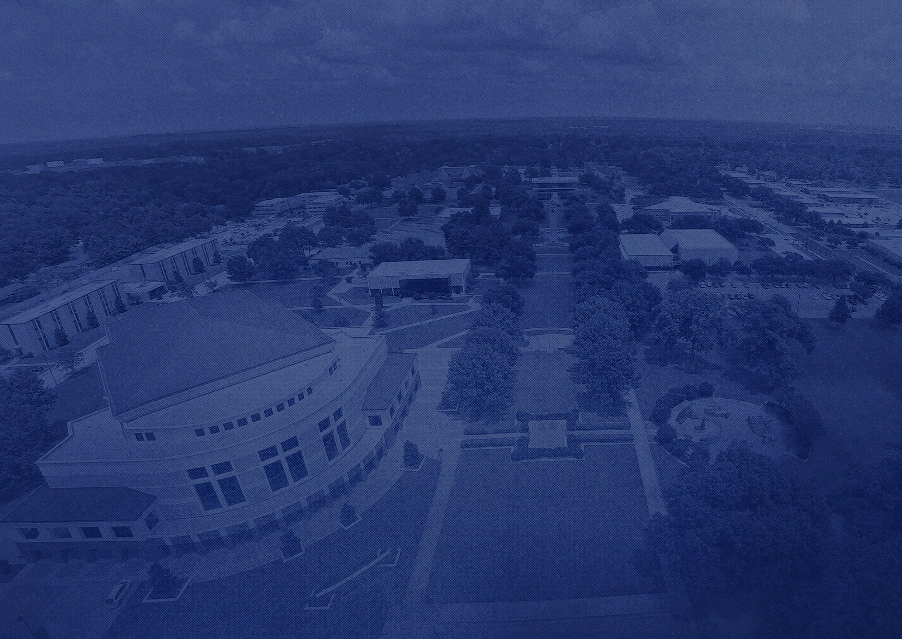 Aerial view of campus with buildings and pathways