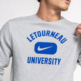 Person wearing a gray Nike sweatshirt with 'Letourneau University' printed on it.